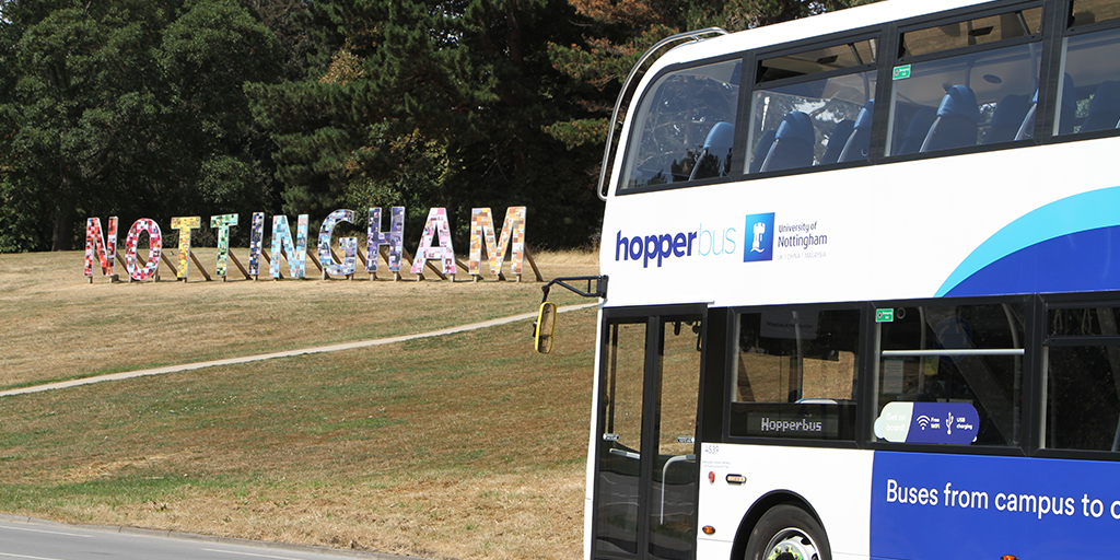 Hopperbus next to Nottingham Sign